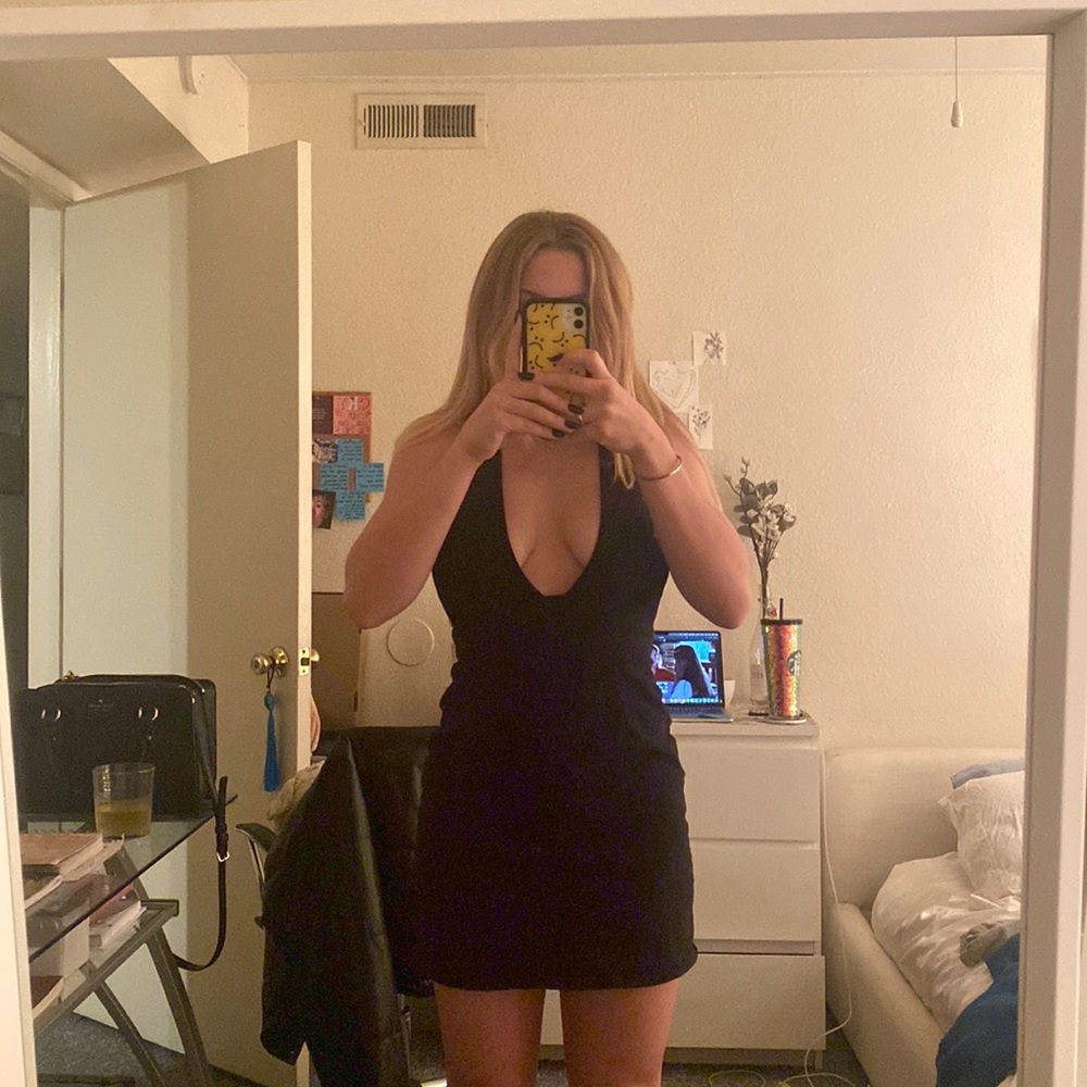very low cut black mini dress
